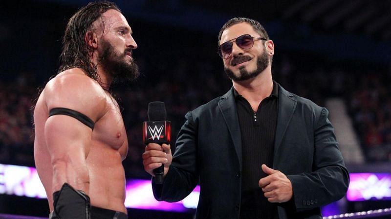 Austin Aries (right) interviewing Neville (left) on an episode of Raw 