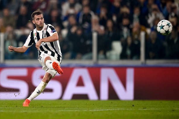 Miralem Pjanic of Juventus FC scores a goal from a free kick...