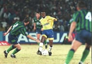 Sundowns striker Russell Molefe (C) dribbles Leeds