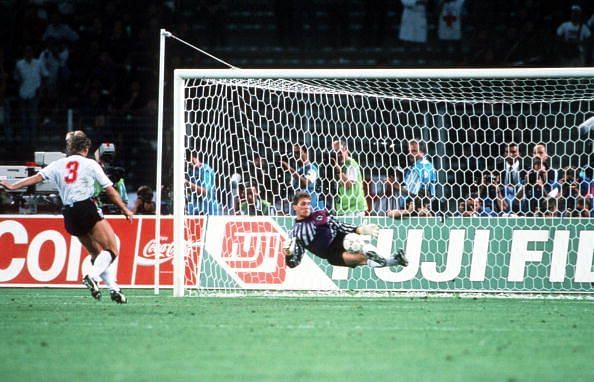 1990 World Cup Semi Final. Turin, Italy. 4th July, 1990. West Germany 1 v England 1 (West Germany win 4-3 on penalties). West Germany&#039;s goalkeeper Bodo Illgner dives to save Stuart Pearce&#039;s penalty kick in the shoot-out.