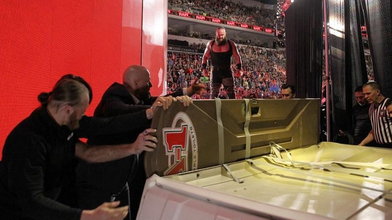 Strowman looked on after throwing the porta-potty down from the stage