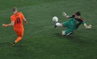 Spain's goalkeeper Iker Casillas (R) pul