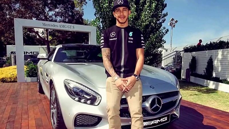Hamilton posing with Mercedes AMG. Photo credit- wiki
