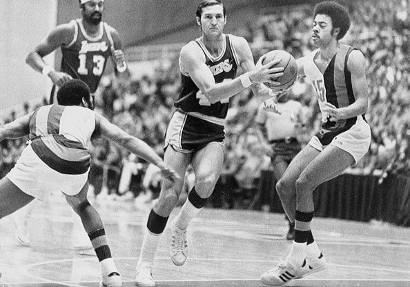 Jerry West (#44) and Wilt Chamberlain (#13)