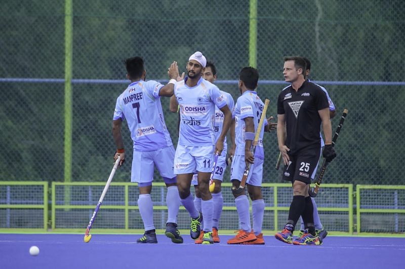 The Indian team celebrate after scoring a goal