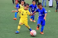 Energetic players from the Under 8 category show-off their dribbling skills during a match