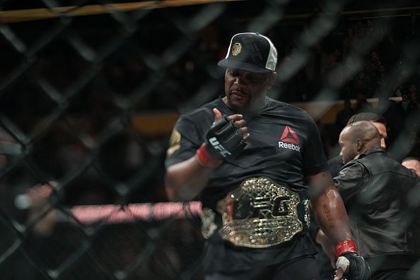 Daniel Cormier with one of his championship belts