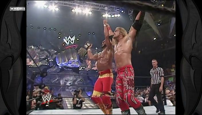 Hulk Hogan and Edge following their tag title win 