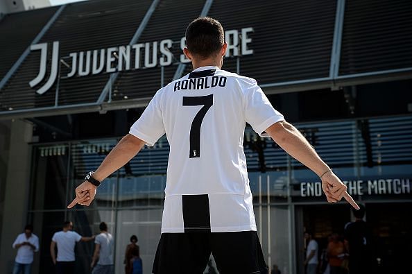 A supporter of Juventus FC poses with Cristiano Ronaldo&#039;s...