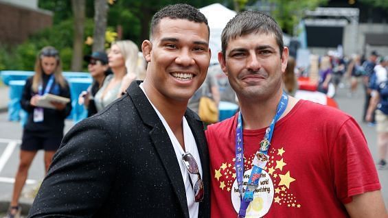 Jason Jordan with a fan and athlete