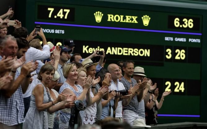 Anderson tops Isner 26-24 at Wimbledon; other SF suspended