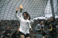 1974 World Cup Final. Munich, West Germany. 7th July, 1974. West Germany 2 v Holland 1. West Germany's Gerd Muller, scorer of the winning goal, waves to the crowd as the team parade the trophy on a lap of honour after the match.