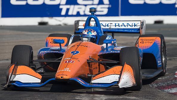 Scott Dixon, of New Zealand, takes the checkered flag at Honda Indy Toronto race