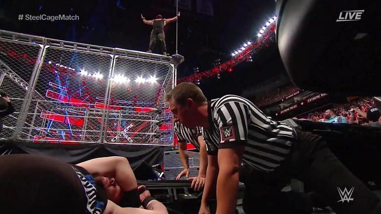 Image result for wwe kevin owens thrown from steel cage