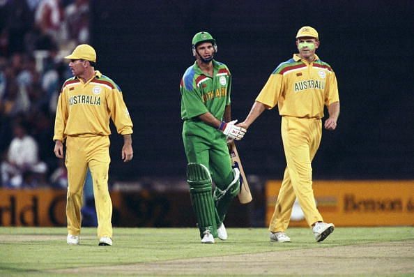 Kepler Wessells of South Africa (center) shakes the hand of Craig McDermot of Australia