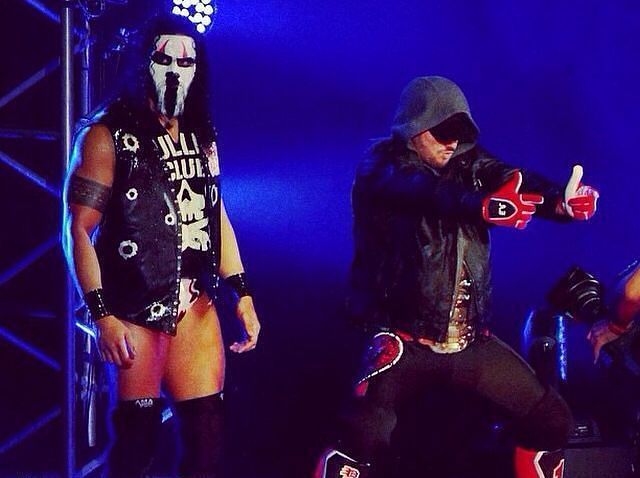 Tama Tonga (left) with AJ Styles (right) as the IWGP Heavyweight Champion during their stint together in The Bullet Club