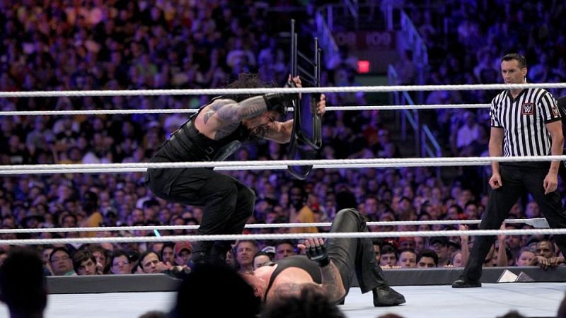 Image result for wwe roman vs undertaker steel chair