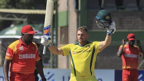 Finch celeberates his 100 against Zimbabwe