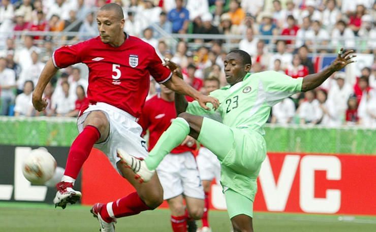 Rio Ferdinand battles Feni Opabunmi for the ball