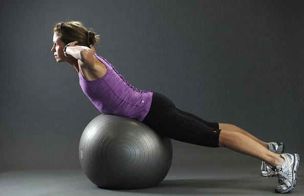 Donna Miller a certified personal trainer and running coach shows core exercises to improve back stability on Thursday, December 2, 2010. This is the finishing point of back extensions on the Swiss ball. Fitness-ball back extension What it works: This bui