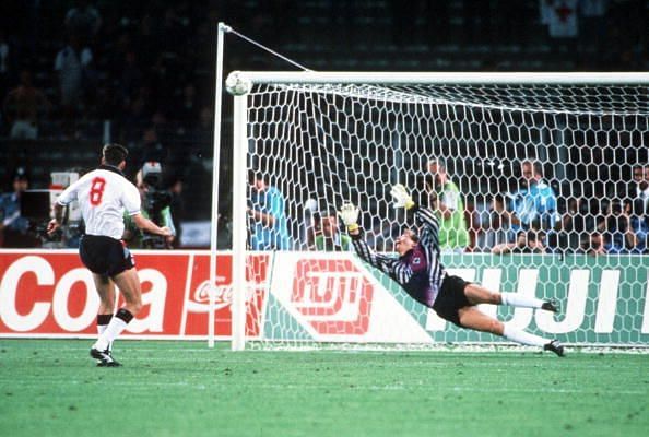 1990 World Cup Semi Final. Turin, Italy. 4th July, 1990. West Germany 1 v England 1 (West Germany win 4-3 on penalties). England&#039;s Chris Waddle fires his penalty over the bar past the dive of West German goalkeeper Bodo Illgner in the shoot -out. The pena