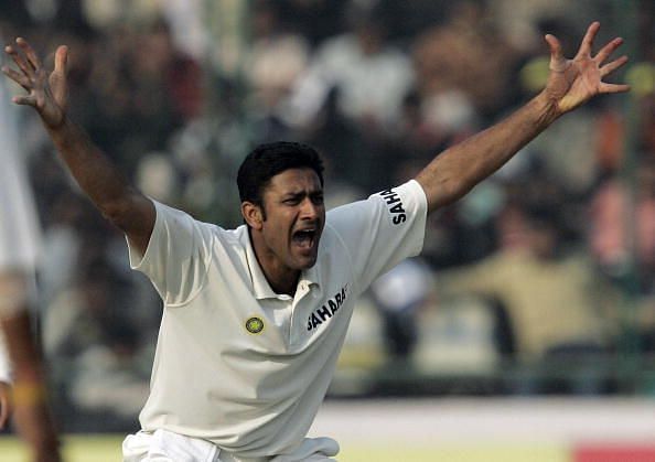 Indian cricketer Anil Kumble gestures to