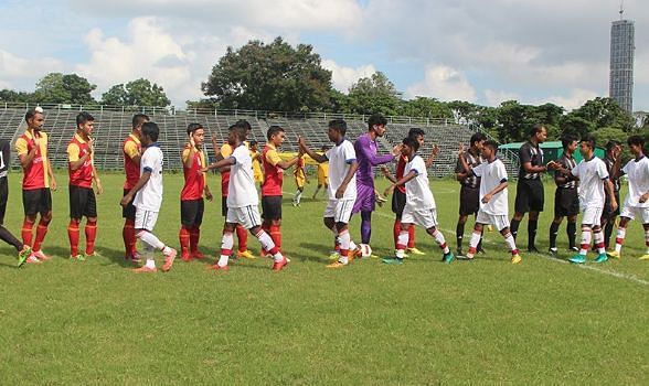 East Bengal and ATK players shake hands before their match