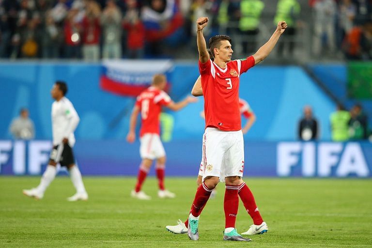 Kupetov raises his arms celebrating a victory