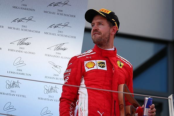 Third place finisher Sebastian Vettel of Germany and Ferrari...