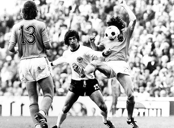 1974 FIFA World Cup in Germany Final in Munich: Germany 2 - 1 Netherlands - Scene of the match: Gerd Mueller (middle) in a tackle with two Dutch players| left: van Hanegem -