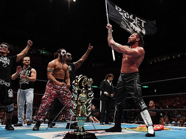 Kenny Omega celebrating his G1 Climax win with The Bullet Club 
