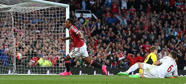 Martial celebrating after scoring on his debut in front of the Stretford end