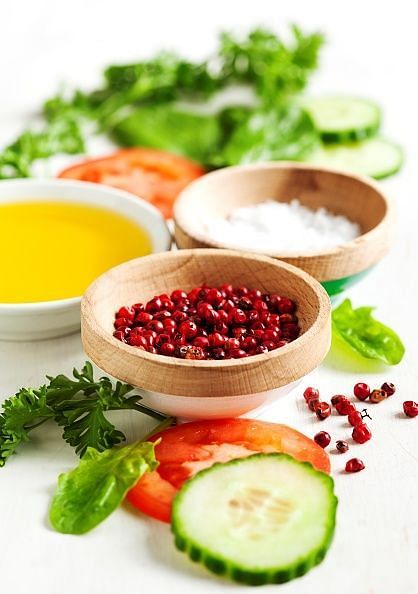 Spices and fresh vegetables for cooking salad. Selective focus