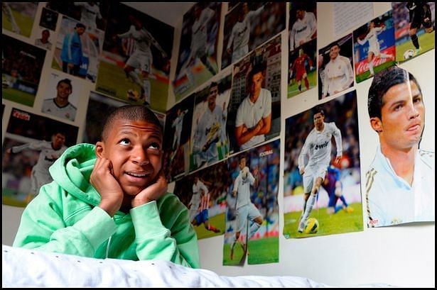 13-year-old Mbappe pictured in his bedroom surrounded by a Cristiano Ronaldo shrine