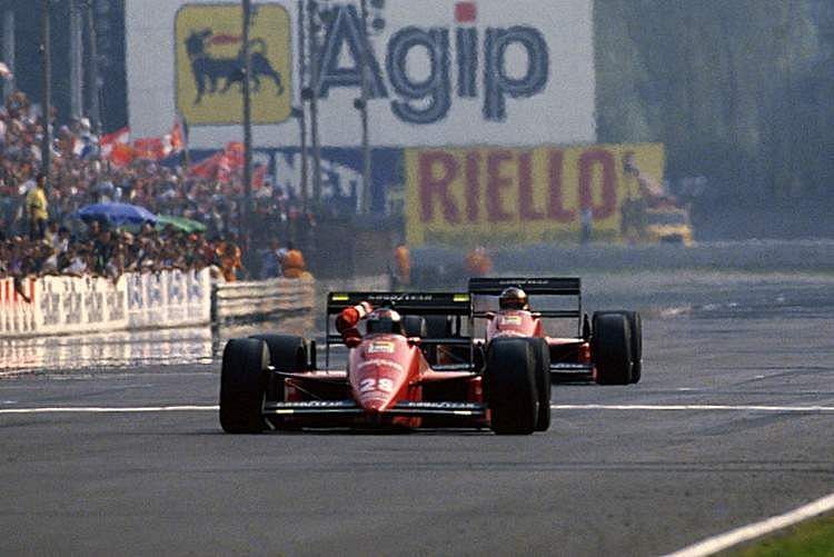 An ecstatic Gerhard Berger taking the chequered flag at Monza in a Ferrari 