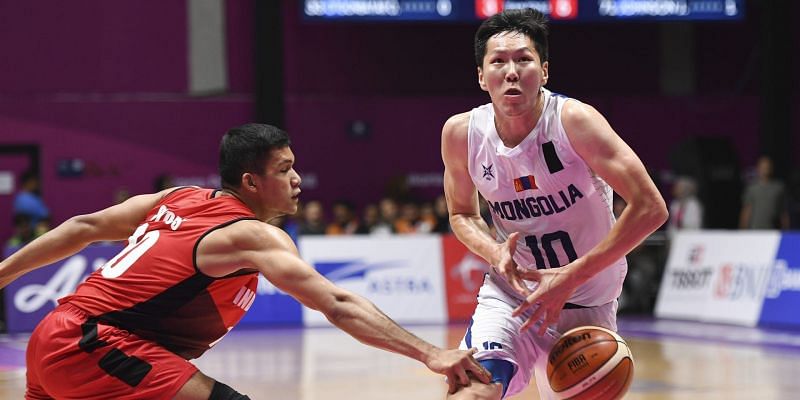 Enter captionAction from Chinese Taipei and Qatar Basketball at the Asian Games on Day 10