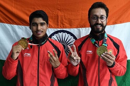 Saurabh Chaudhari and Abhishek Verma with their medals