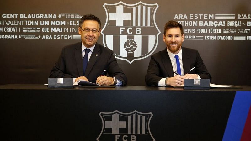 L-R; President Josep Maria Bartomeu and Lionel Messi during the new contract signing