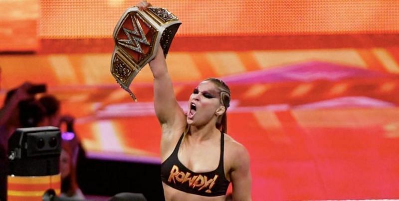 &#039;Rowdy&#039; Ronda Rousey celebrating after winning the RAW Women&#039;s Champioship