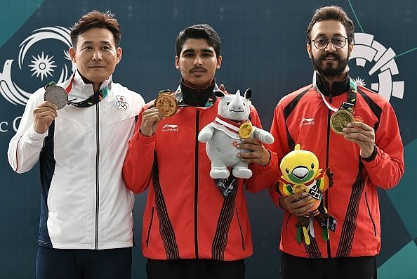 Saurabh Chaudhary and Abhishek Verma with their medals. 