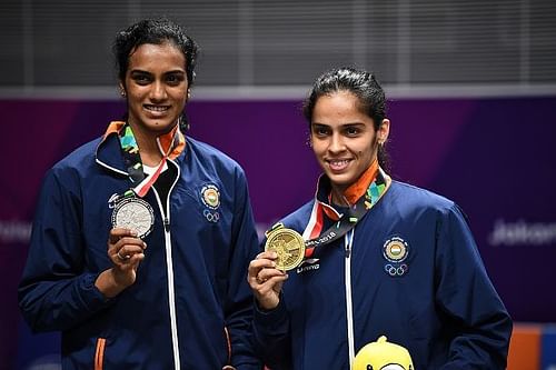 Sindhu (left) and Saina (right) with their respective medals.