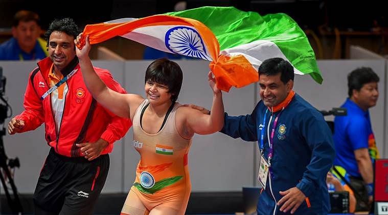 Bronze medalist Divya Kakran of India poses on the podium
