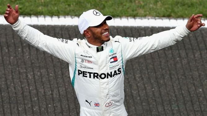 Hamilton shines after Spa shower to take pole in Belgium