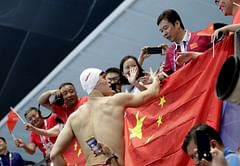 Sun rises, flags fall on opening night of swimming finals