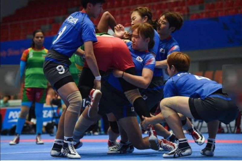 The South Korean women&#039;s team tackling a Bangladeshi player in group stage match of Asian Games 2014.
