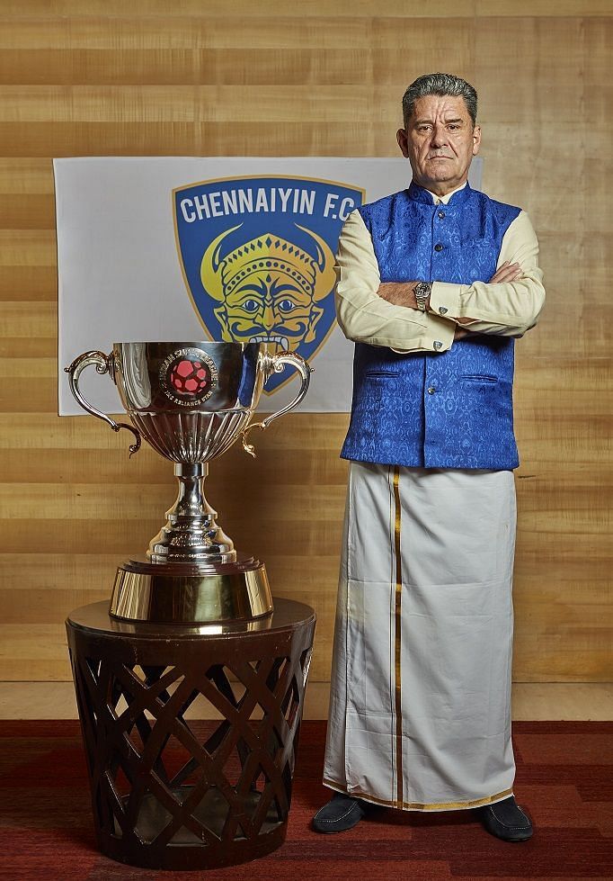 John Gregory in traditional attire with the ISL trophy