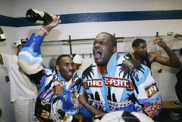 Kobe Bryant and Shaquille O&#039;Neal celebrating their third straight NBA Championship in 2002.