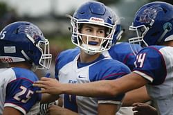 Brother of slain Iowa student leads prep team to victory