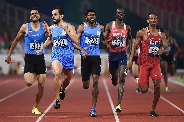 India&#039;s Manjit Singh, India&#039;s Jinson Johnson (2nd and 3rd from right) run towards glory!