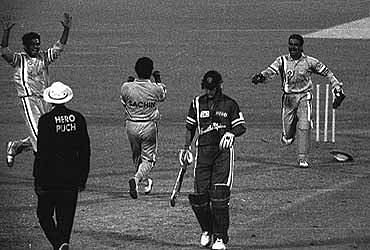 Sachin Tendulkar celebrates after bowling the last over